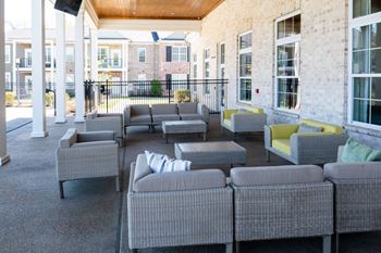 Outdoor patio with couches and tables